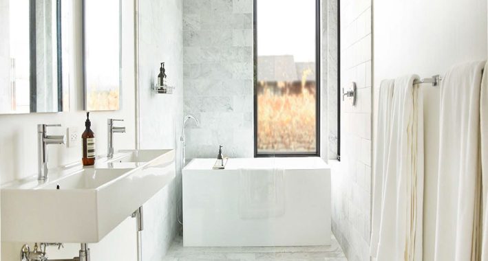 Modern guest house bathroom with tub and shower