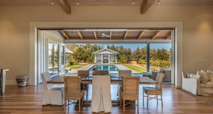 Modern Farmhouse view from dining area to exterior pool